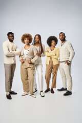 Obraz premium group of stylish african american people posing together on grey background, Juneteenth concept