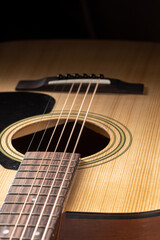 Classical guitar close up. Acoustic guitar on wood background.Music instrument concept