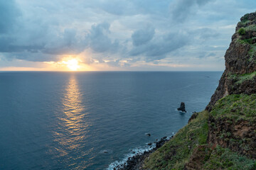 Sunset over the ocean from a hiking trail at madeira island