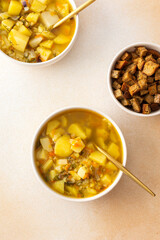 Pea soup with fried croutons, healthy bean soup, top view