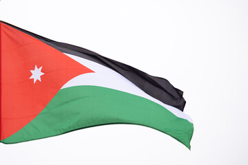 Large Jordan flag fluttering in the wind..Flag of the Jordanian Arab Resistance to the Ottoman...