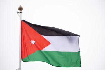 Large Jordan flag fluttering in the wind..Flag of the Jordanian Arab Resistance to the Ottoman Empire.