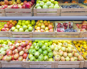 buying fruits(grape,bananas, apples, pears, lemons, orange, lime, tangerine)  at the market