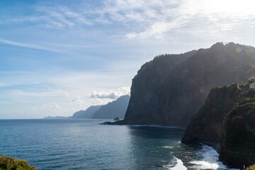 Waves crashing into the cliffs of madeira island