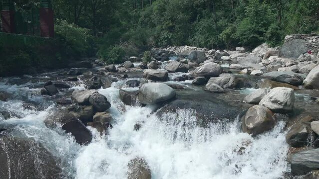  Journey of water as it gracefully flows through Uttarakhand's majestic rivers, carving a path of natural beauty.4k footage 