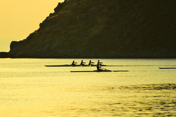 rowing (skiff) at sunset - Paralia Richa Nera (beach), Myrina, Lemnos island, Greece, Aegean sea