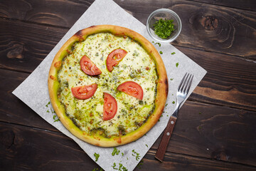tasty pizza on the wooden background