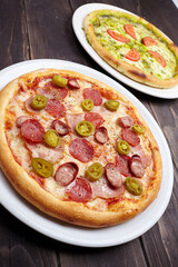 tasty pizza on the wooden background