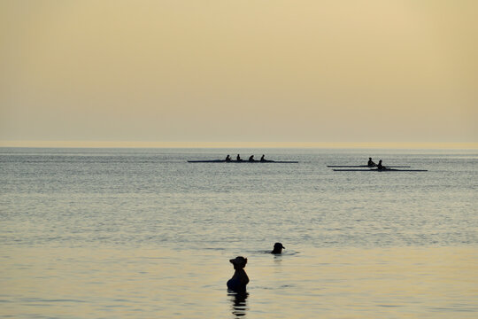 rowing (skiff) at sunset - Paralia Richa Nera (beach), Myrina, Lemnos island, Greece, Aegean sea