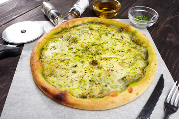 tasty pizza on the wooden background