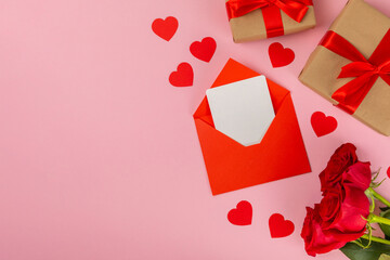Valentine's Day concept.Valentine's Day background. Gifts, candles, confetti, envelope - postcard,...