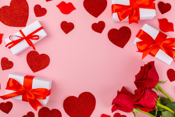 Valentine's Day concept.Valentine's Day background. Gifts, candles, confetti, envelope - postcard, candy, glasses, wine and a bouquet of roses on a colored background. Flatley.Valentine's day celebrat