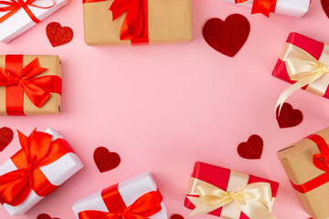 Valentine's Day concept.Valentine's Day background. Gifts, confetti, card on a pink background. Flatley.Valentine's day celebration. place for text.