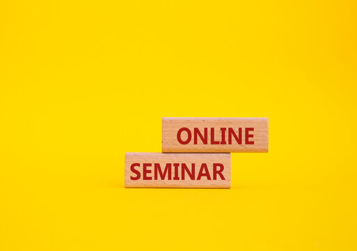 Online Seminar symbol. Concept word Online Seminar on wooden blocks. Beautiful yellow background. Business and Online Seminar concept. Copy space