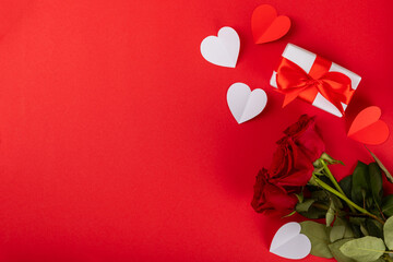 Valentine's Day concept.Valentine's Day background. Gifts, candles, confetti, envelope - postcard, candy, glasses, wine and a bouquet of roses on a colored background. Flatley.Valentine's day celebrat