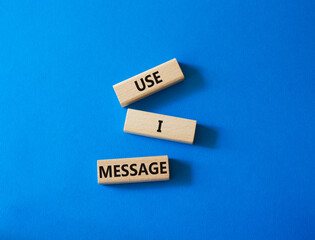 Use I message symbol. Concept word Use I message on wooden blocks. Beautiful blue background. Business and Use I message concept. Copy space.