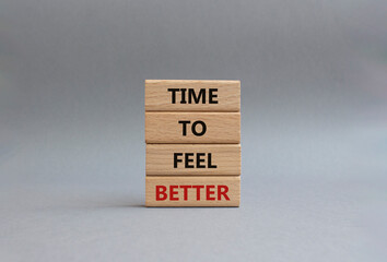 Time to feel better symbol. Wooden blocks with words Time to feel better. Beautiful grey...