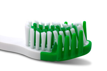 Green toothbrush on white background - 705767333