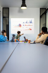 Fototapeta premium Diverse group of young business people working on new project together in office.