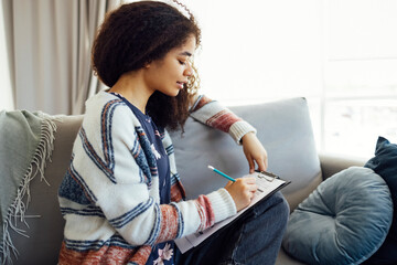 Pretty afro american student prepares for examination or classes