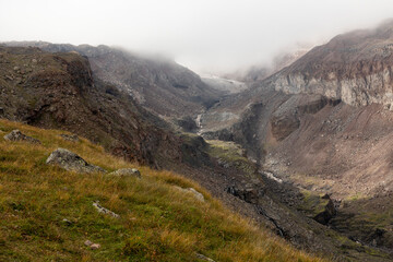 Fototapeta premium Panoramic landscape of glacial mountain valley during summer in Caucasus mountains