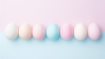 Multi-colored Easter eggs in pastel colors, on a pink and blue background