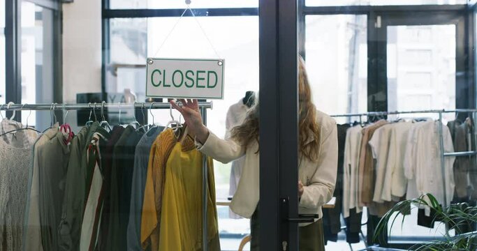 Woman, fashion store and closed sign on window, salesperson and clothing shop. Shopkeeper, retail worker and entrepreneurship in boutique, business owner and confident at door, signage and alone