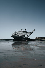 Ruins of boat on the beach