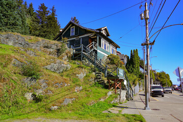 Historic wooden houses built on a slope in the Alaskan mountains in Ketchikan, the southernmost city of Alaska, USA