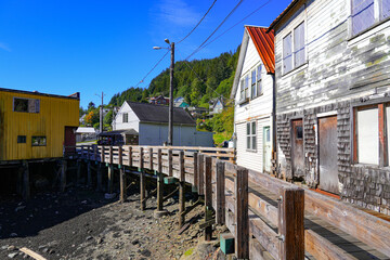 Wooden houses along a boardwalk in Hopkins Alley in Ketchikan, the southernmost city of Alaska, USA - obrazy, fototapety, plakaty