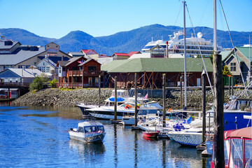 Fototapeta na wymiar Sailboats in the marina of Ketchikan, the southernmost city of Alaska, surrounded by the Tongass National Forest