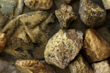 Texture of stones painted in gold and brown colors.