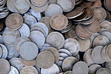 Indian Old vintage coins, vintage coin abstract with English & Indian coins in forefront.