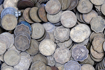 Indian Old vintage coins, vintage coin abstract with English & Indian coins in forefront.