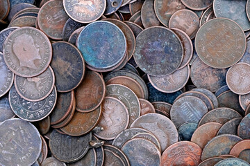 Indian Old vintage coins, vintage coin abstract with English & Indian coins in forefront.