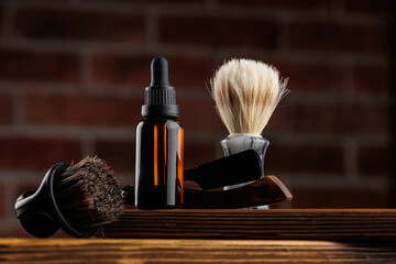 Cosmetics for man, Bottle essential oil for beard men on background dark brick.