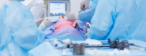 Banner minimally invasive surgery, team doctors use medical equipment, operating room hospital....