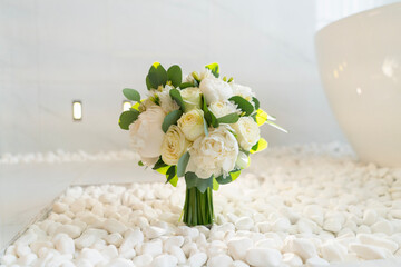 beautiful wedding bouquet of the bride of white roses and green eucalyptus close-up, romantic...