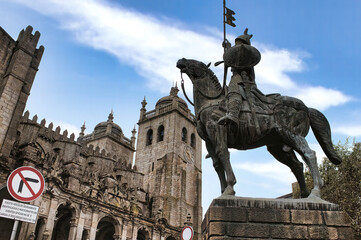 The Statue of Vímara Peres against the backdrop of the beautiful Porto Cathedral in Portugal