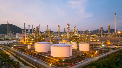 Oil and gas industrial refinery at twilight, Oil refinery and Petrochemical plant pipeline steel,...