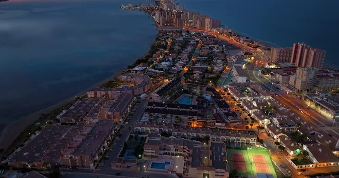 Establishing aerial shot of the city of manga, in La Manga del Mar Menor Murcia impressive view of the buildings and beaches. Spectacular travel destination La Manga