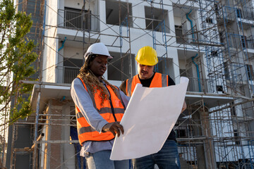 Engineer inspect building structure technicians looking at analyzing unfinished construction project