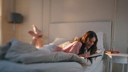 Thoughtful woman writing daily diary in morning. Dreamy teenager share thoughts