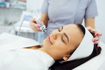 Caucasian woman getting face peeling procedure in a beauty clinic