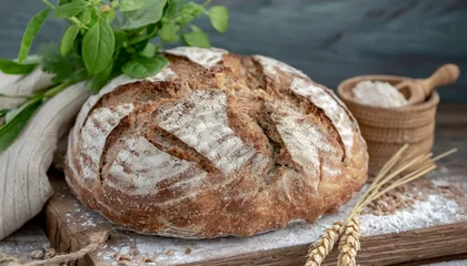 Tuinposter sourdough bread with crispy crust on wooden shelf bakery goods © Katherine
