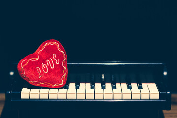 red heart on piano. music background - 705816751