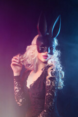 sexy portrait of a bunny girl. a girl with white hair wearing a black hare mask.