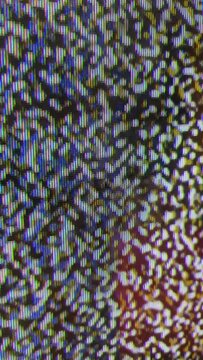 Close up view at a plasma tv while showing noise activity.