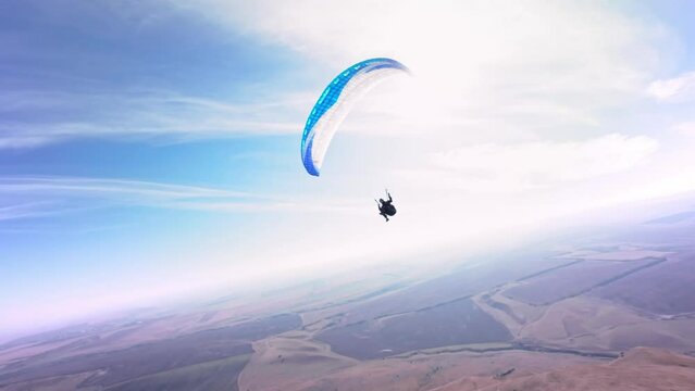 Aerial view. Chasing a hang glider in the air. Unique aerial photographs of extreme sports shot on a sports fpv quadcopter
