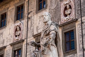 Fototapeta na wymiar Rich ornate facade of the Palazzo della Carovana in the center of Pisa